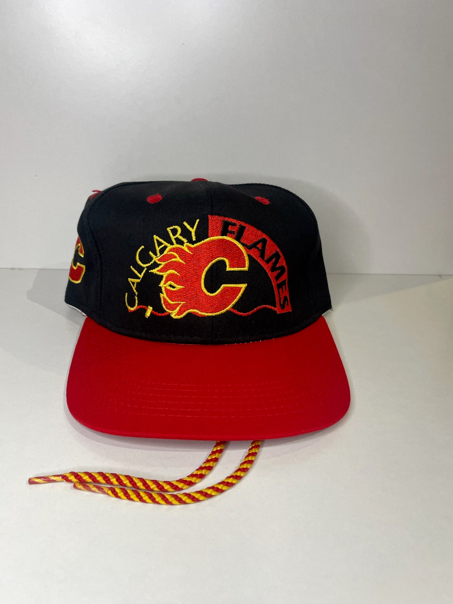 VINTAGE 90s CALGARY FLAMES #1 APPAREL DRAWSTRING CAP HAT