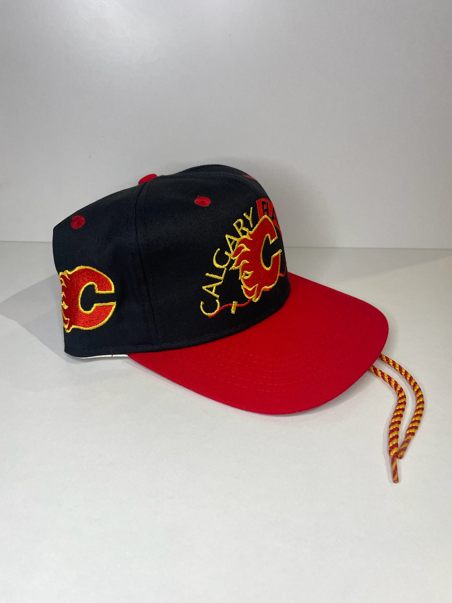 VINTAGE 90s CALGARY FLAMES #1 APPAREL DRAWSTRING CAP HAT