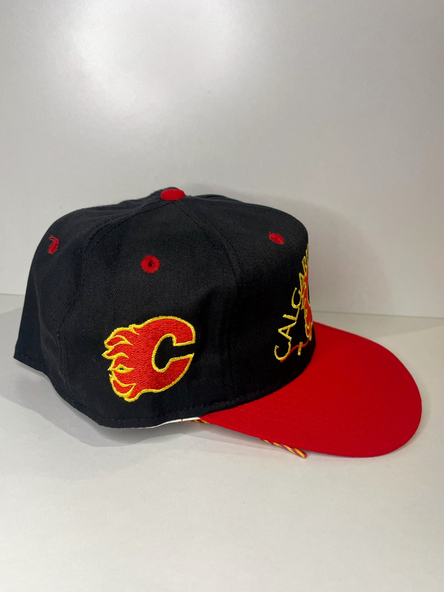 VINTAGE 90s CALGARY FLAMES #1 APPAREL DRAWSTRING CAP HAT